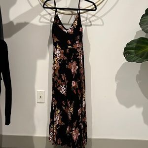 Black floral jump suit, with high leg slit